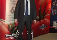 Richard Woolard demonstrates stilts used for tomato and fruit harvesting, manufactured by Carobyn Products.