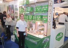 At the booth of Hashiloni Farm visitors learn how to grow sprouts themselves. A small box contain soil, a tub and seeds.