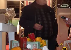 Husam Alzurba presents his capsicum and tomatoes.
