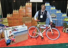 Brett Burdsal from CMI International shows the bike that can be won after sending in a nice photo with the cherries. www.cmiapples.com