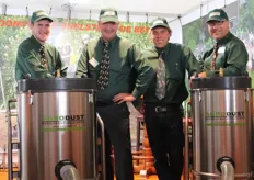 Jan Struik, Jan Schuringa, Vincent Verhagen and Luk Vermeulen from Agrodust pose with their industrial vacuum cleaner.