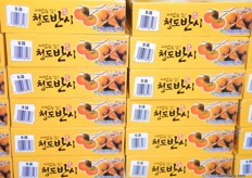 boxes of persimmon for sale... a Buddhist symbol of transformation