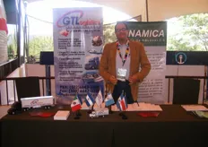 GT Logistics' Plant Manager, Juan Fernando Batre, in front of GT's stand touting their shipping and logistics solutions.