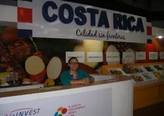 Amanda Salazar in front of the Costa Rica stand, educating attendees about the group of companies exporting produce from Costa Rica.