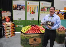 Howard Nager from Domex Superfresh Growers next to their new dsiplay, which is more environmentally friendly to print.
