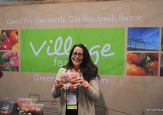Helen Aquino from Village Farms holding the Exquisite heirloom tomato