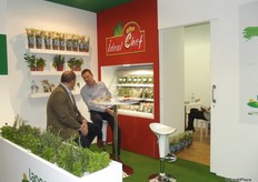 Ian Summerfield, CEO of Langmead Farms chats to a visitor.