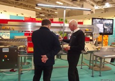 Colin Platt explains about the Packhouse Solution Yield Control system at the Marco stand.