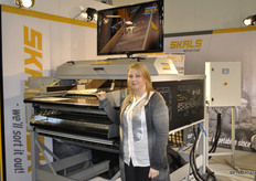Olga Spirina Jensen for Skals, Denmark. Olga is standing in front of their latest machine.