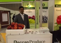 Nagesh Shetty at Deccan Produce presenting pomegranates and grapes from India.