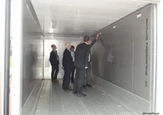 Delegates are shown the inside of Denso's new container.
