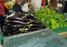 Long aubergines and big green peppers.