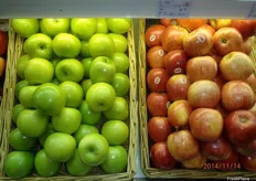 Loose apples displayed in baskets.