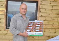 Erez Eitan from Dvine Growers holds his packaging for the export.