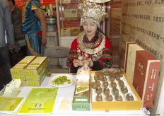 Gizhou Holy Land Organic Agriculture offering a tase of their organic kiwis.