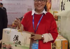 Miss Zhang with walnuts from Henan Yuan Natural Ag. Co.