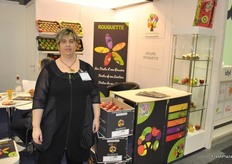 Céline Mura from Groupe Rouquette next to the boxes that are designed for the far destinations like China