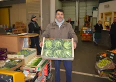 Mustafa Eroglu is proudly presenting a box of cabbage of Karl Klees GmbH.