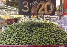 A mountain of loose avocados.