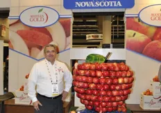 Franco DiLiberatore from Scotian Gold next to their big apple statue.