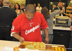 Chef/Musician Roger Mooking is preparing one of his recipes with Sunset greenhouse products.