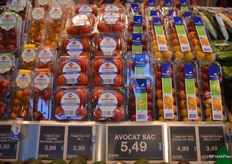 Packaged greenhouse tomatoes, including grape tomatoes, cherry tomatoes and a tri-colored tomato cocktail.