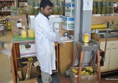 At the shop they had unpeeled pineapples.