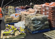 Potatoes and onions in the grower's section, available by the bag.