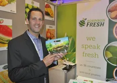 Dusty Waldron from Robinson Fresh holds a bag with avocadoes. The company is the sole global distributor of avocadoes and asparagus of the Green Giant brand.