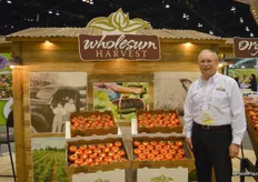 Steve LeFevre with Wholesum Harvest proudly showing tomatoes.