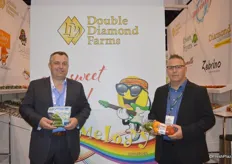 Larry LaBute and Craig Klingbyle with Double Diamond Farms showing mini cucumbers and a three-pack of heirloom tomatoes.