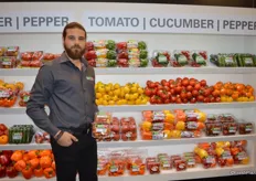 Mitch Amicone with Amco Produce, proudly showing medley tomatoes.