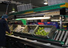 The cartons are emptied by hand before going to the bagging machine.