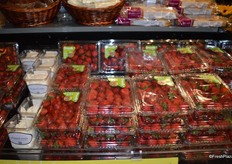 Close-up of the large clamshells with strawberries. These large clamshells are very common during the peak season.