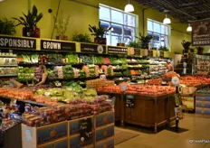 Vertical merchandising on the side and education for the customer regarding the grocer's Responsibly Grown program.