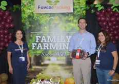 Liz Rodriguez, Kevin Souza and Kristy Marthedal of Fowler Packing. Kevin shows a 4lb clamshell with grapes, primarily sold at warehouse stores.