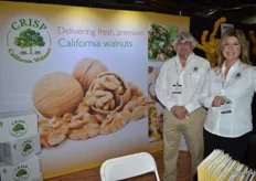 Jim Crisp and Diana Peck with Crisp California Walnuts. A walnut dispenser in the booth offered attendees opportunities to try.