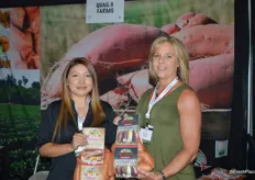 Angie Maciel and Larelle Miller with Quail H Farms, showing sweet potatoes in new high-graphic bags.