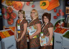 Uniformity and smiles in the booth of the Ontario Greenhouse Vegetable Growers. From left to right: Nancy Hewitt, Fiona McLean and Margaret Wigfield.