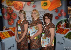Uniformity and smiles in the booth of the Ontario Greenhouse Vegetable Growers. From left to right: Nancy Hewitt, Fiona McLean and Margaret Wigfield.