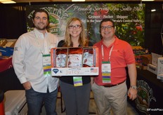 Gunner White, Jeri Elasser and Dennis Surabian with Trinity Fruit Sales, showing a new product: frozen pomegranate arils.