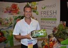 Nick Williamson with Mucci Farms, proudly showing Naked Leaf lettuce.