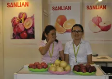 Alice Xie and Janey Zhang, the sales team of Shaanxi Sanlian Fruit Group Co., Ltd. are having a giggle.