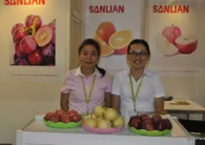 Alice Xie and Janey Zhang of Shaanxi Sanlian Fruit Group Co., Ltd., a fruit producing and export company.