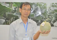 Zheng Jian Jun, of Hainan Pure Green Agricultural R&D Co., Ltd., is presenting his Japanese melon, which the company grows in Hainan.