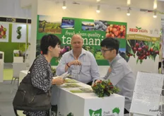 Phil Pyke, the business development manager of Fruit Growers Tasmania is informing an international audience at his stand.