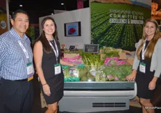 Dave Martinez, Angela Salinas and Gabriella Besan showing broccoli rabe and other vegetable items from D'Arrigo Brothers.