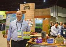 Brian Jenny from Naturipe Farms proudly showing the snack packs of blueberries that won the PMA Impact Award for Excellence in Packaging. Congratulations!