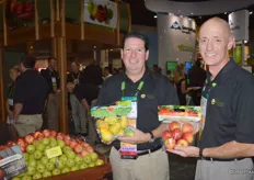 Howard Nager and Loren Queen of Domex Superfresh Growers showing pouch bags with pears and apples.