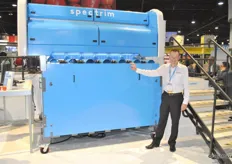 Mike Riley from Compac next to the new grading machine Spectrim